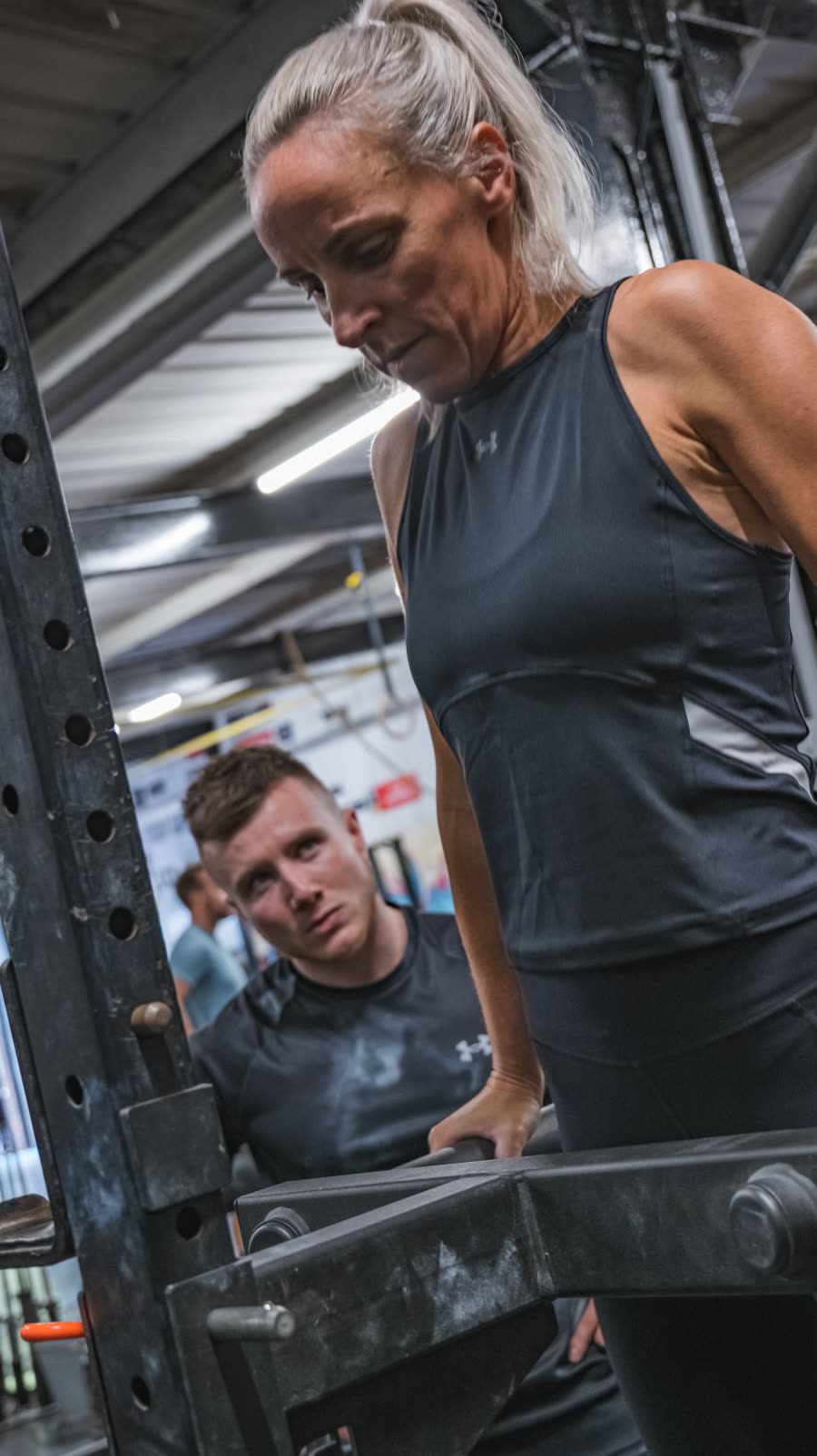 Mikey coaching a client through a lift